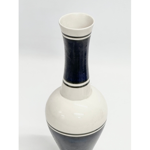 53 - A set of 20th Century painted ceramic vases with narrow necks and bases. Stamped underneath. 25cm