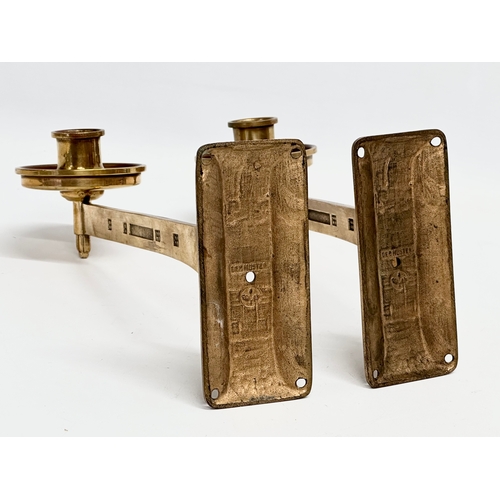 23 - A pair of Late 19th/Early 20th Century brass wall mounted candleholders. Dep Muster. 23cm