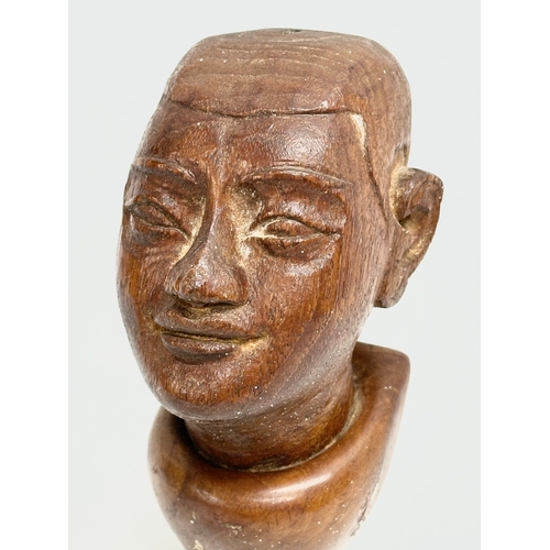 55 - A 19th Century Burmese teak bust wall plaque. 18cm