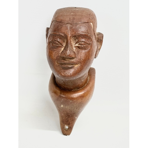 55 - A 19th Century Burmese teak bust wall plaque. 18cm