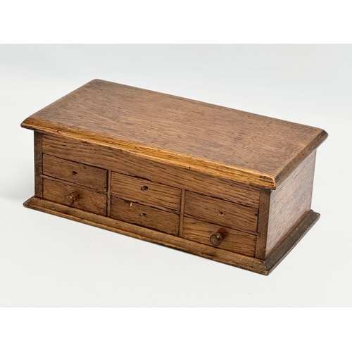 56 - An Early 20th Century oak watchmakers chest. 23x12x9cm