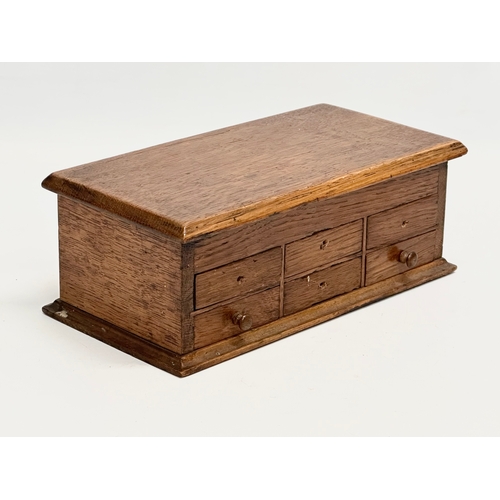 56 - An Early 20th Century oak watchmakers chest. 23x12x9cm