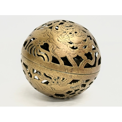 24 - An Early 19th Century Chinese brass spherical incense burner/hand warmer/oil lamp. 12x12cm