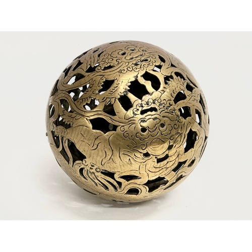 24 - An Early 19th Century Chinese brass spherical incense burner/hand warmer/oil lamp. 12x12cm