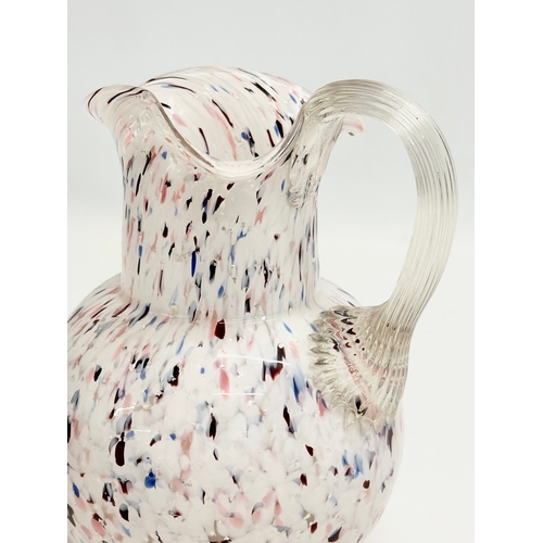 127 - A Late 19th Century Bohemian Spatter Glass jug. 13x12x17cm