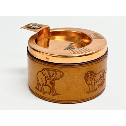 105 - A pair of South African Durban Lines ships copper and leather bound ashtrays. 11.5x13x8cm