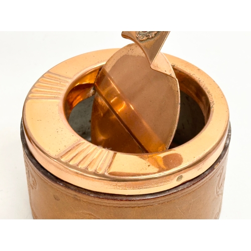 105 - A pair of South African Durban Lines ships copper and leather bound ashtrays. 11.5x13x8cm