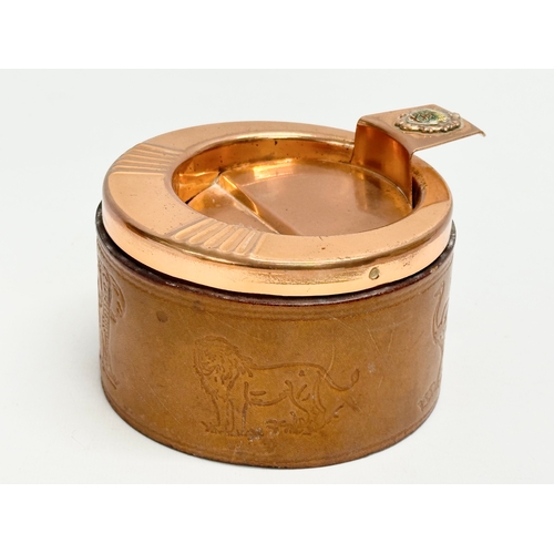 105 - A pair of South African Durban Lines ships copper and leather bound ashtrays. 11.5x13x8cm