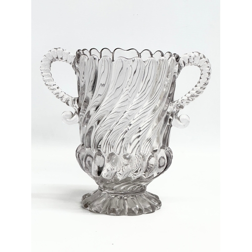 61 - A Late 19th Century Edward Moore & Co pressed glass 2 handled vase. Circa 1885-1895. 21x13x19cm