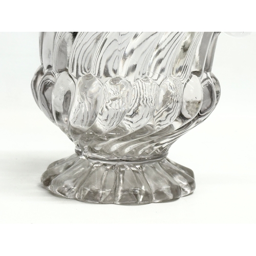 61 - A Late 19th Century Edward Moore & Co pressed glass 2 handled vase. Circa 1885-1895. 21x13x19cm