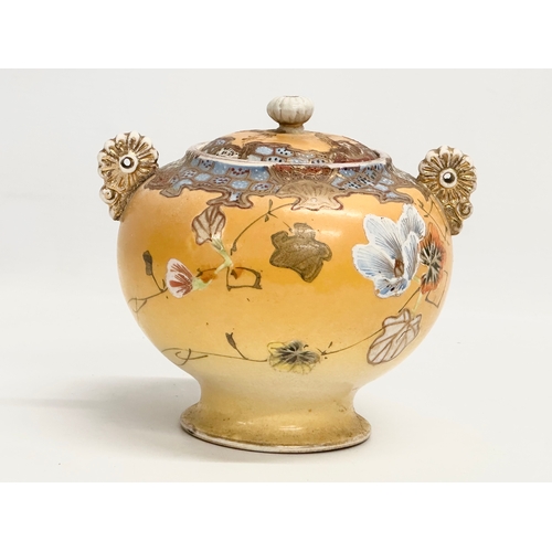 109 - A Late 19th Century signed Japanese Meiji period 2 handled urn with lid by Satsuma. 15.5x14x15cm