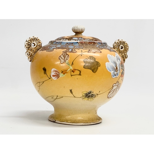 109 - A Late 19th Century signed Japanese Meiji period 2 handled urn with lid by Satsuma. 15.5x14x15cm