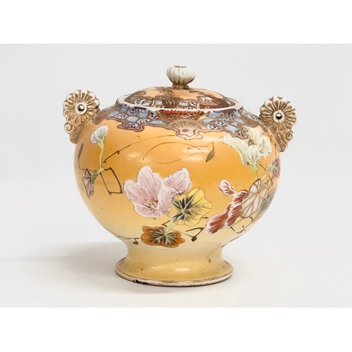 109 - A Late 19th Century signed Japanese Meiji period 2 handled urn with lid by Satsuma. 15.5x14x15cm