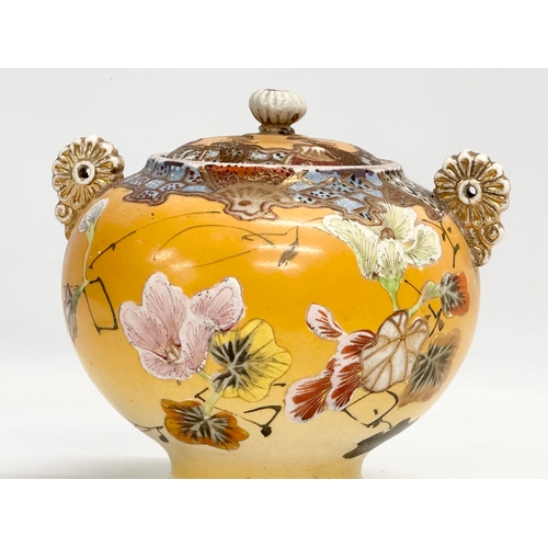 109 - A Late 19th Century signed Japanese Meiji period 2 handled urn with lid by Satsuma. 15.5x14x15cm