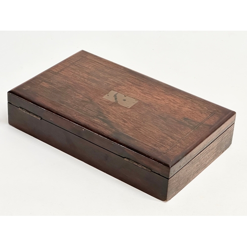 123 - A Victorian rosewood desktop box. 23.5x14.5x5cm