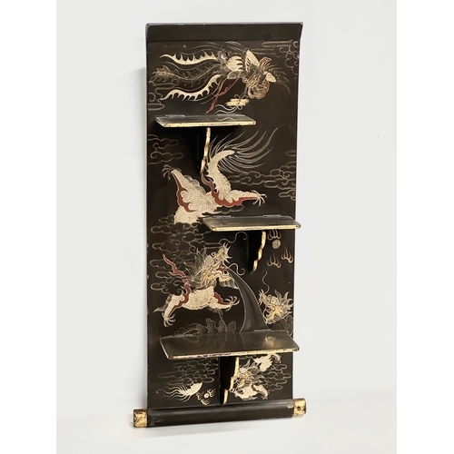 32 - An Early 20th Century Japanese hand painted lacquered wall shelf. Circa 1900-1920. 25x56cm