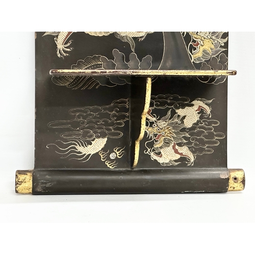 32 - An Early 20th Century Japanese hand painted lacquered wall shelf. Circa 1900-1920. 25x56cm