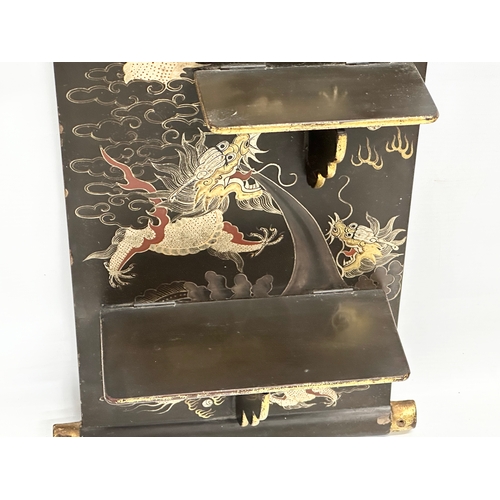 32 - An Early 20th Century Japanese hand painted lacquered wall shelf. Circa 1900-1920. 25x56cm