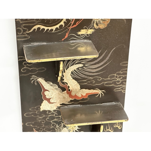 32 - An Early 20th Century Japanese hand painted lacquered wall shelf. Circa 1900-1920. 25x56cm