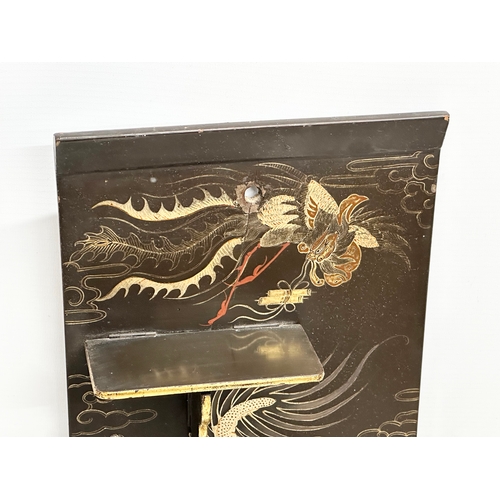 32 - An Early 20th Century Japanese hand painted lacquered wall shelf. Circa 1900-1920. 25x56cm