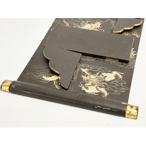 32 - An Early 20th Century Japanese hand painted lacquered wall shelf. Circa 1900-1920. 25x56cm