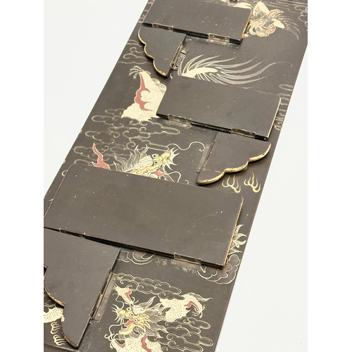 32 - An Early 20th Century Japanese hand painted lacquered wall shelf. Circa 1900-1920. 25x56cm