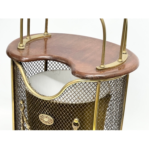 34 - A Mid Century teak and brass combination magazine rack/paper waste basket. 28x17x59cm