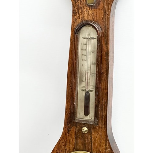 65 - A George IV rosewood barometer. 98cm