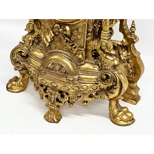 38 - A large 18th Century style French gilt mantle clock. 35x20x59cm