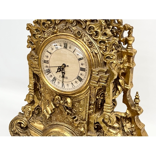 38 - A large 18th Century style French gilt mantle clock. 35x20x59cm