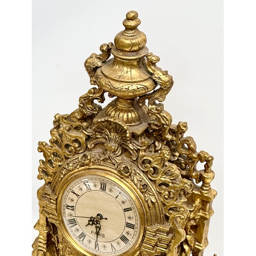 38 - A large 18th Century style French gilt mantle clock. 35x20x59cm