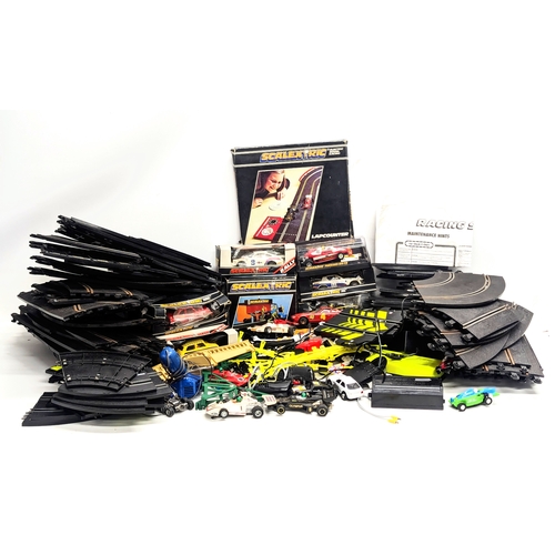 661 - A large quantity of vintage Scalextric, including tracks, cars, etc. With 2 other racecar tracks.