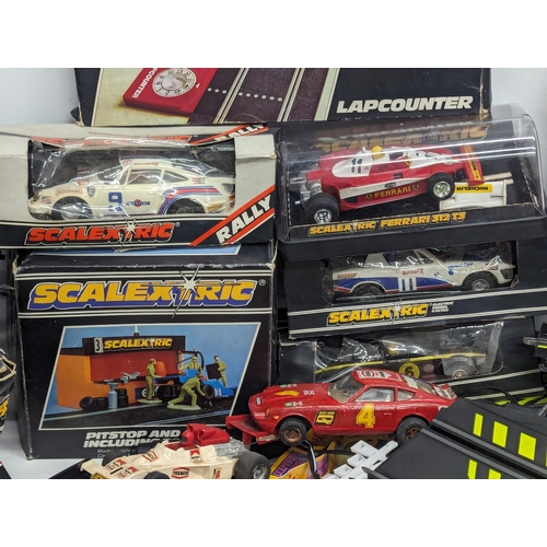 661 - A large quantity of vintage Scalextric, including tracks, cars, etc. With 2 other racecar tracks.