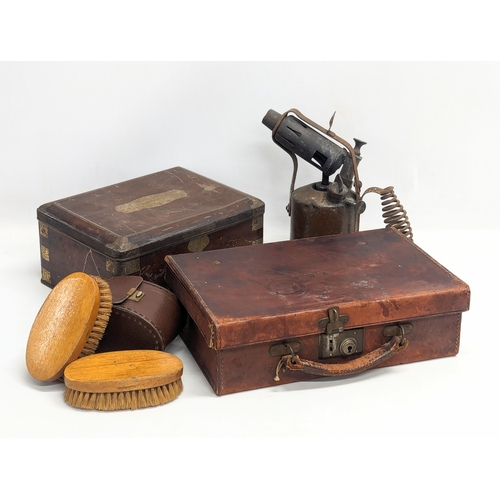 662 - A job lot including a Early 20th Century leather case, tin, etc.