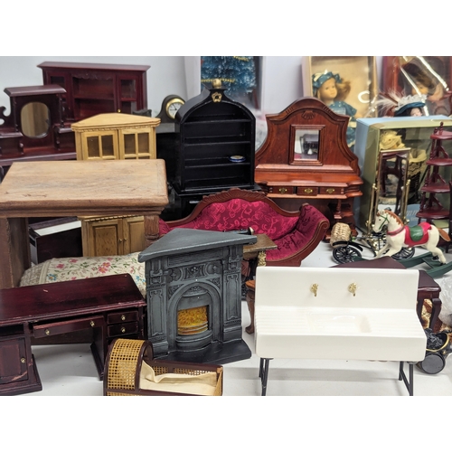 663 - A large collection of vintage doll house furniture, including dolls, accessories, etc.