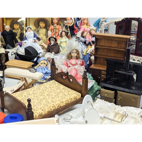 663 - A large collection of vintage doll house furniture, including dolls, accessories, etc.