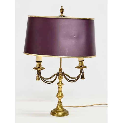 660 - A brass table lamp with draped rope design. 38x28x58cm