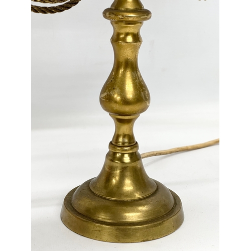 660 - A brass table lamp with draped rope design. 38x28x58cm