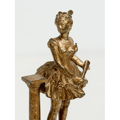 655 - A late 19th century spelter figurine on marble base. 13cm