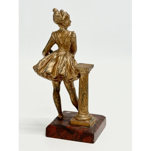 655 - A late 19th century spelter figurine on marble base. 13cm