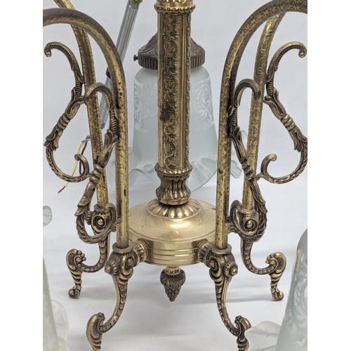 679 - A mid to late 20th century brass chandelier with etched glass shades with frilled rims. 56x66cm