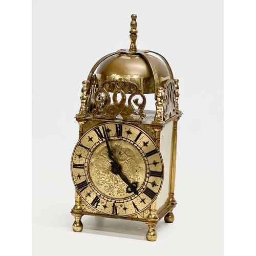 682 - A vintage 18th century style brass mantle clock by Smiths. 10x10x25cm