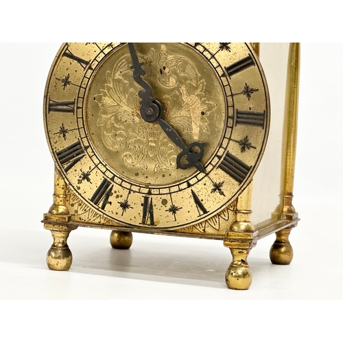 682 - A vintage 18th century style brass mantle clock by Smiths. 10x10x25cm