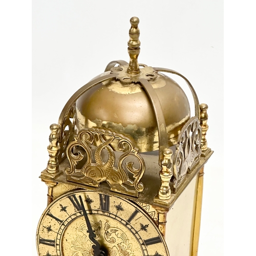 682 - A vintage 18th century style brass mantle clock by Smiths. 10x10x25cm