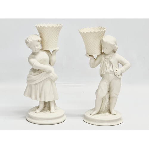 648 - A pair of Belleek Pottery ‘Basket Carrier’ figurines. Girl basket Bearer, Boy Basket Bearer. 21.5cm