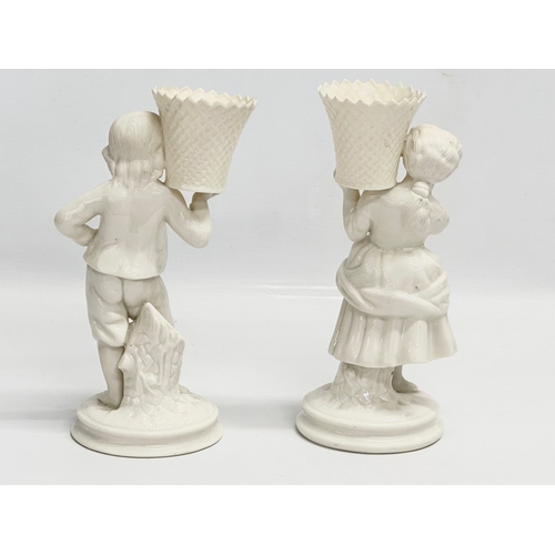 648 - A pair of Belleek Pottery ‘Basket Carrier’ figurines. Girl basket Bearer, Boy Basket Bearer. 21.5cm
