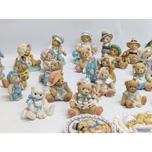 667 - A collection of Cherished Teddies figures. Priscilla Hillman.