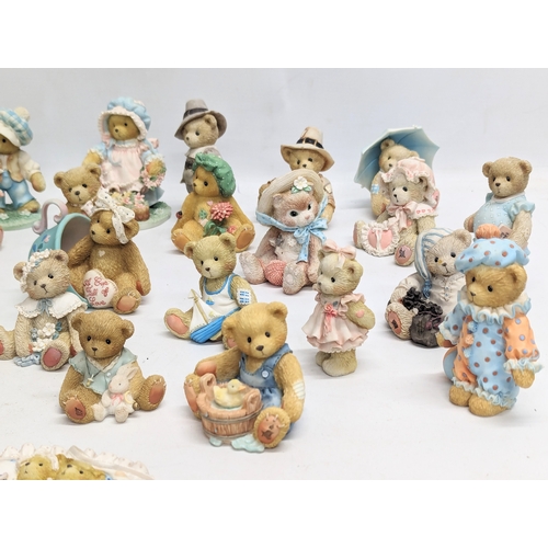 667 - A collection of Cherished Teddies figures. Priscilla Hillman.