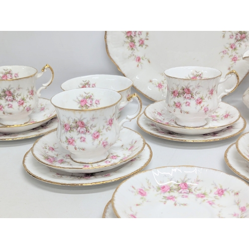 673 - A Paragon 'Victoriana Rose' pottery tea service, including cake plate.