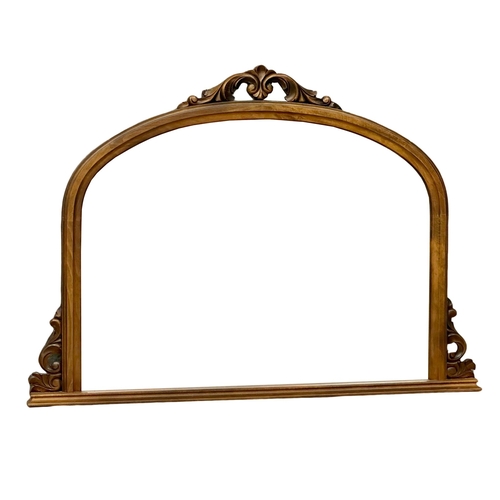 674 - A Victorian style over-mantle mirror, with bevelled glass.  128x93cm